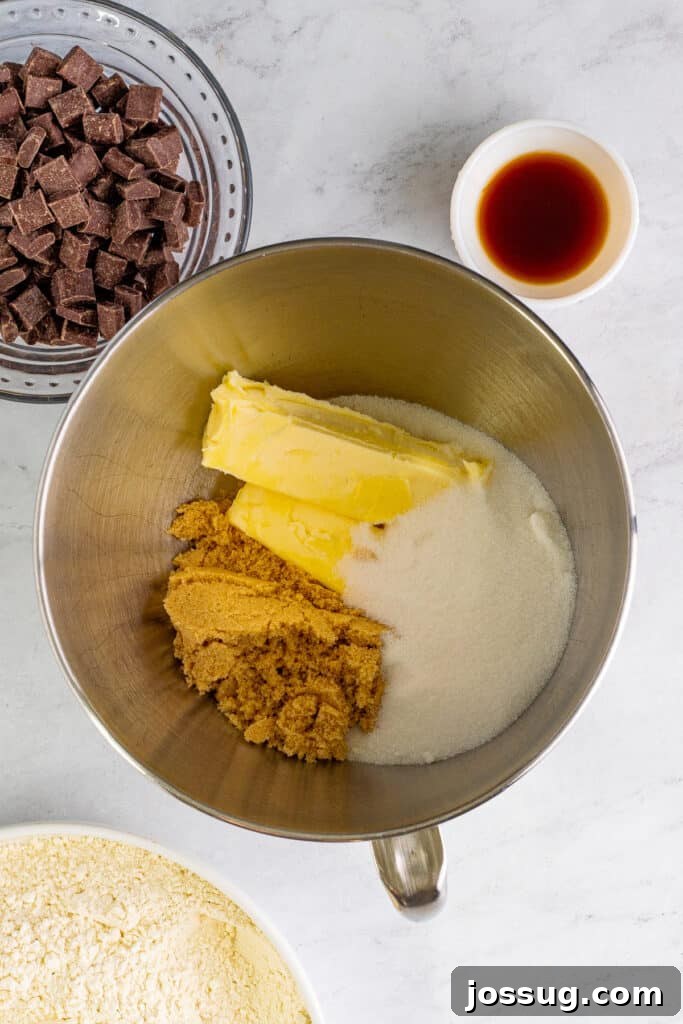 Softened butter, light brown sugar, and granulated sugar in a stand mixer bowl, perfectly prepped for creaming.