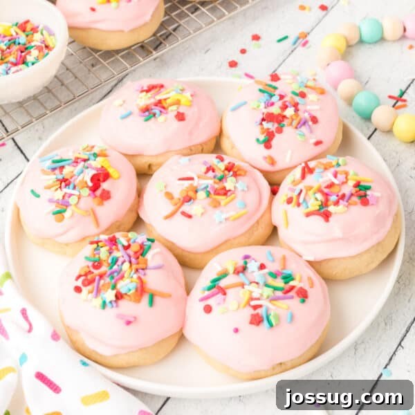 Soft Sugar Cookies with pink frosting and sprinkles.