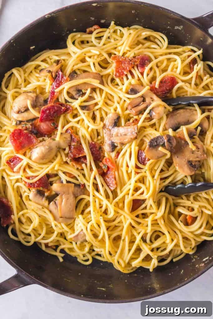 Bacon & Mushroom Carbonara 10 Tossing carbonara in a skillet