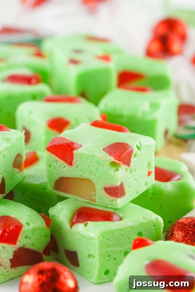 Grinchmas Nougat Nibblers 2 Bright green Grinch Christmas Nougat squares with red gumdrops.