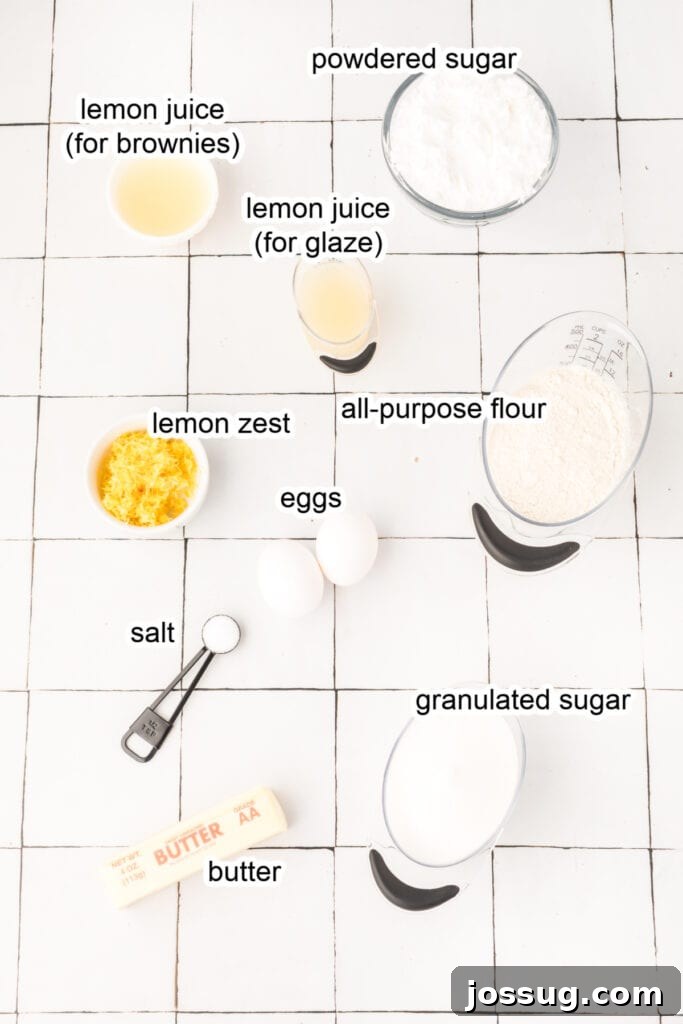 Arrangement of fresh ingredients including lemons, flour, sugar, butter, and eggs, ready to make lemon brownies