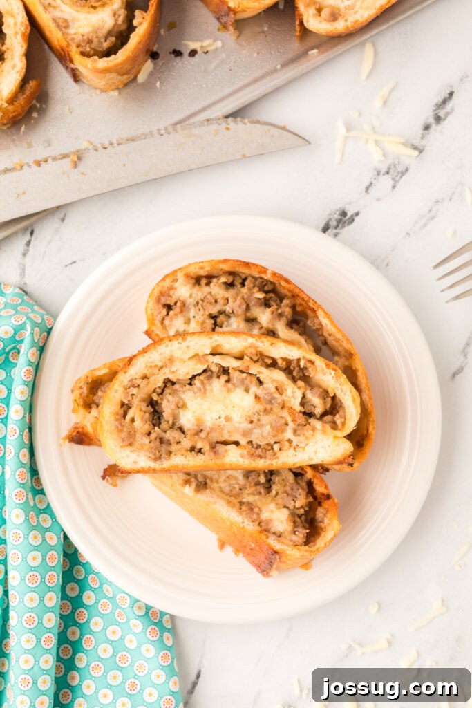 Overhead shot of a plate with several slices of sausage bread, perfect for sharing.