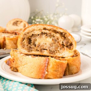 Close-up of baked sausage bread slices, showing the delicious filling and golden crust.