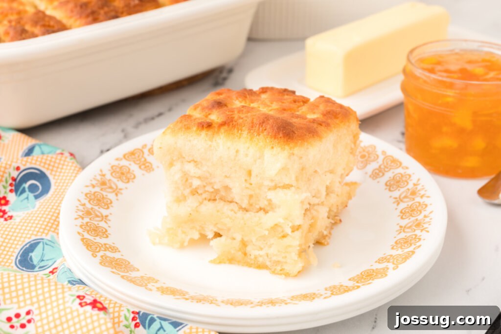 A large serving platter piled high with golden butter dip biscuits, ready for a gathering.
