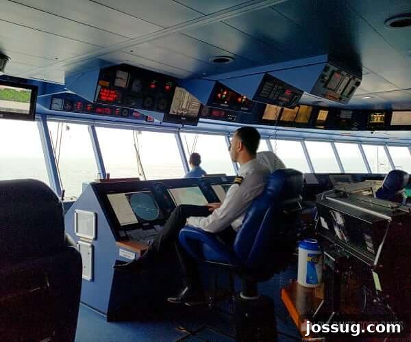Last-Minute Cruises: Sail Sooner, Save More 6 The impressive bridge of an Island Princess cruise ship, with the captain confidently at the helm, navigating the open seas.