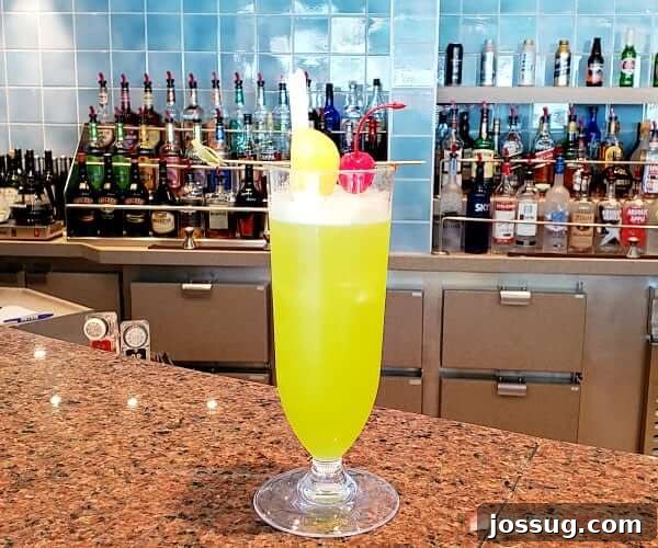 Smooth Sailing from the Start: Embarkation Day Essentials 17 Top Ten Must-Dos on Embarkation Day- An alcoholic beverage sits on a bar top of a cruise ship.
