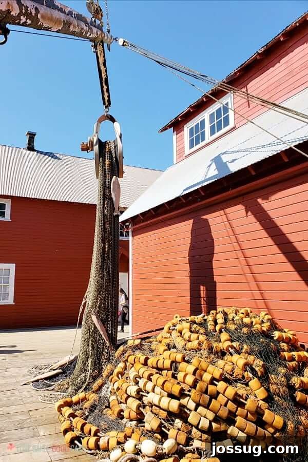 Smooth Sailing from the Start: Embarkation Day Essentials 10 Alaska Fishing nets piled next to a red building.