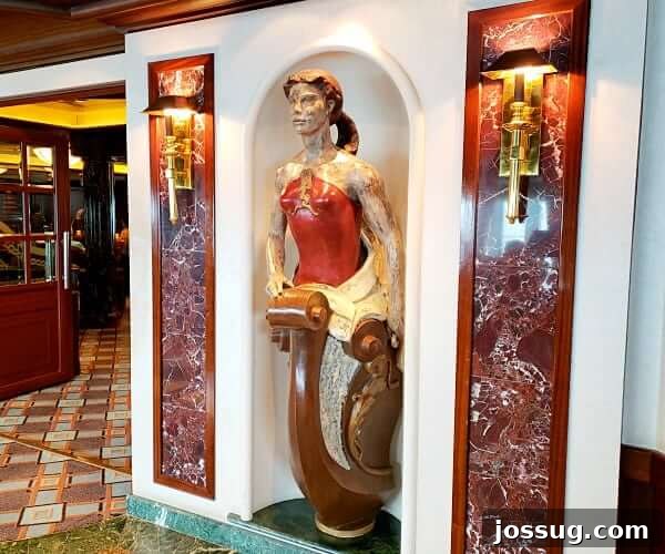 Artwork on a cruise ship near the entrance of a sophisticated restaurant, hinting at elegant dining.