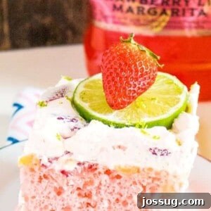 The Boozy Strawberry Margarita Poke Cake, ready to be served at your next party.