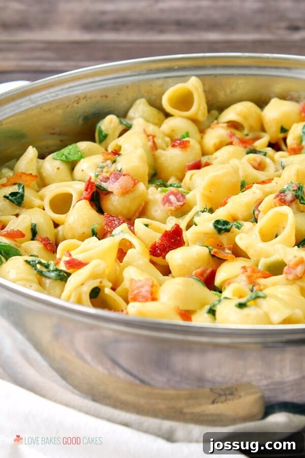 Effortless Creamy Bacon Spinach One-Pot Pasta 2 Close-up of One-Pot Creamy Bacon Spinach Pasta in a large skillet, highlighting the rich sauce and perfectly cooked pasta.