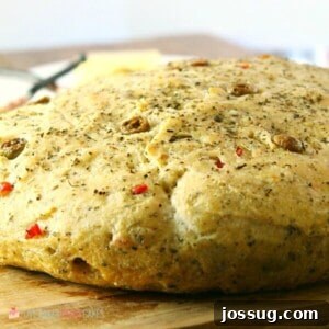 No-Knead Skillet Olive Bread! It's a super easy to make, crusty, homemade bread packed with olives and herbs.