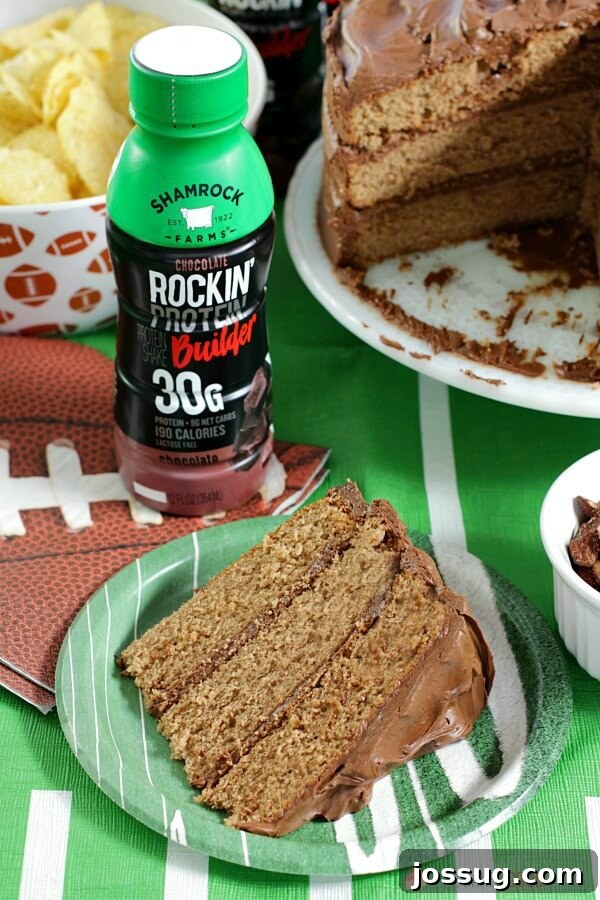 Dreamy Chocolate Milk Cake 3 A slice of Chocolate Milk Cake on a plate next to a bottle of Shamrock chocolate milk.
