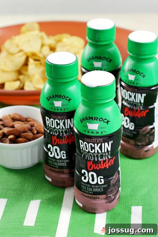 Dreamy Chocolate Milk Cake 5 Four bottles of Shamrock chocolate milk with a bowl of tortilla chips and nuts.