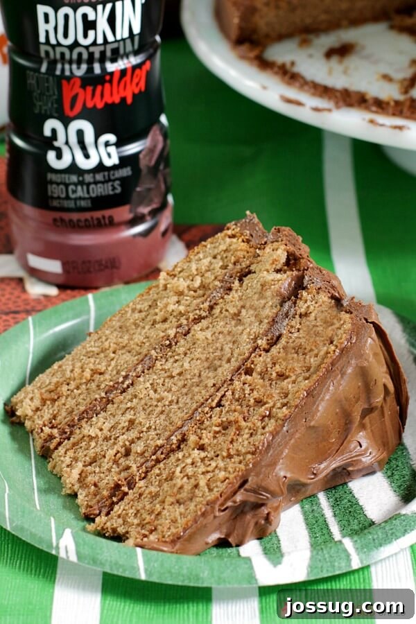 Dreamy Chocolate Milk Cake 6 A slice of chocolate milk cake on a plate with a bottle of Shamrock chocolate milk nearby.