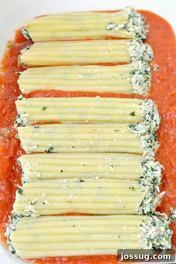 Baking dish filled with Spinach Ricotta Manicotti, ready to bake.