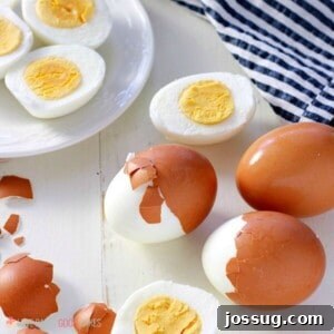 Square image of easy to peel perfect hard-boiled eggs, showing a beautifully cooked yolk.