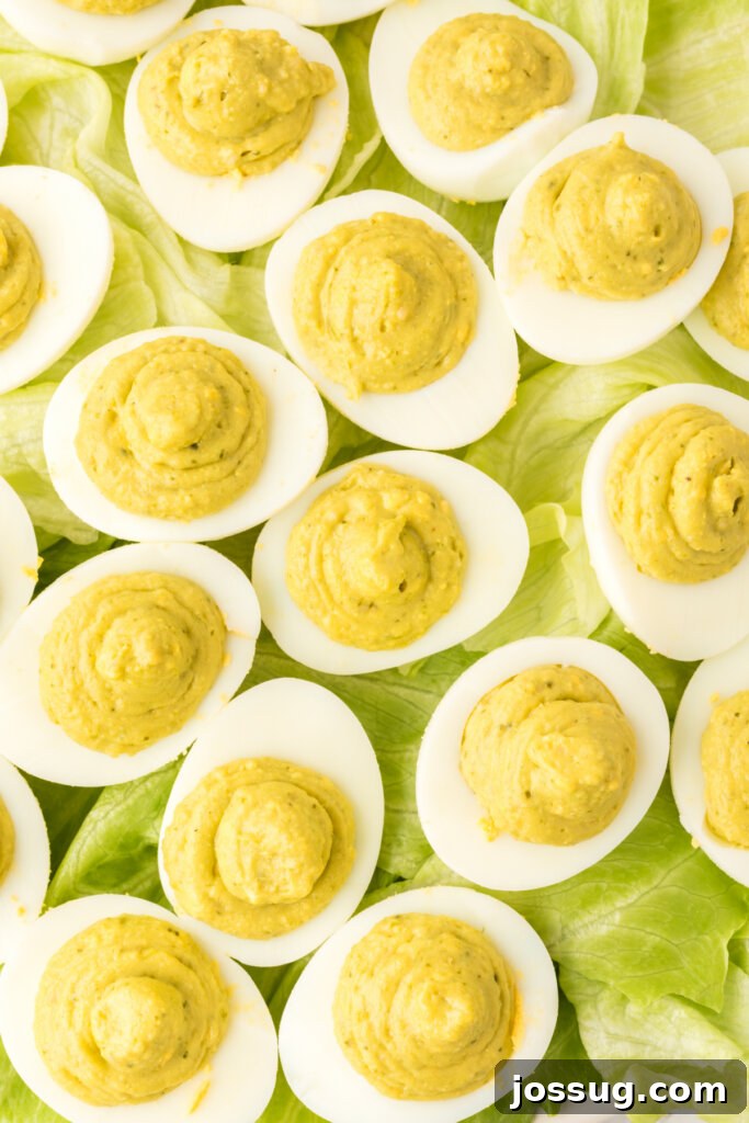 pesto deviled eggs on lettuce leaves