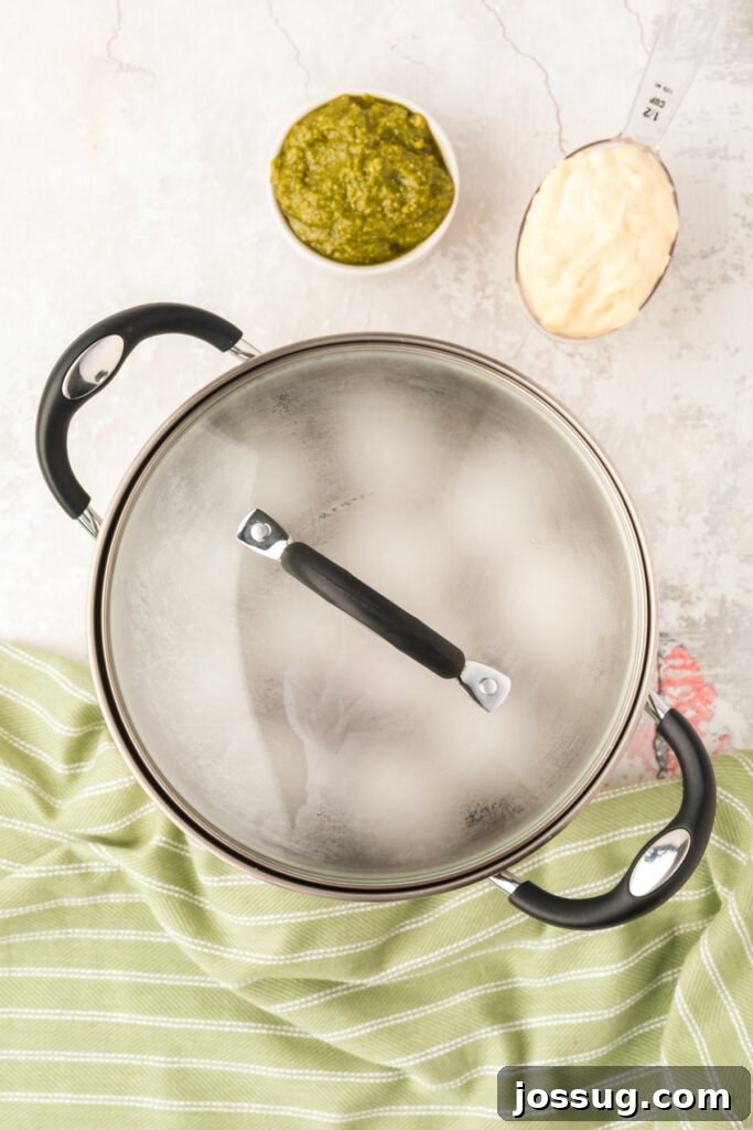 eggs being hard boiled in a saucepan
