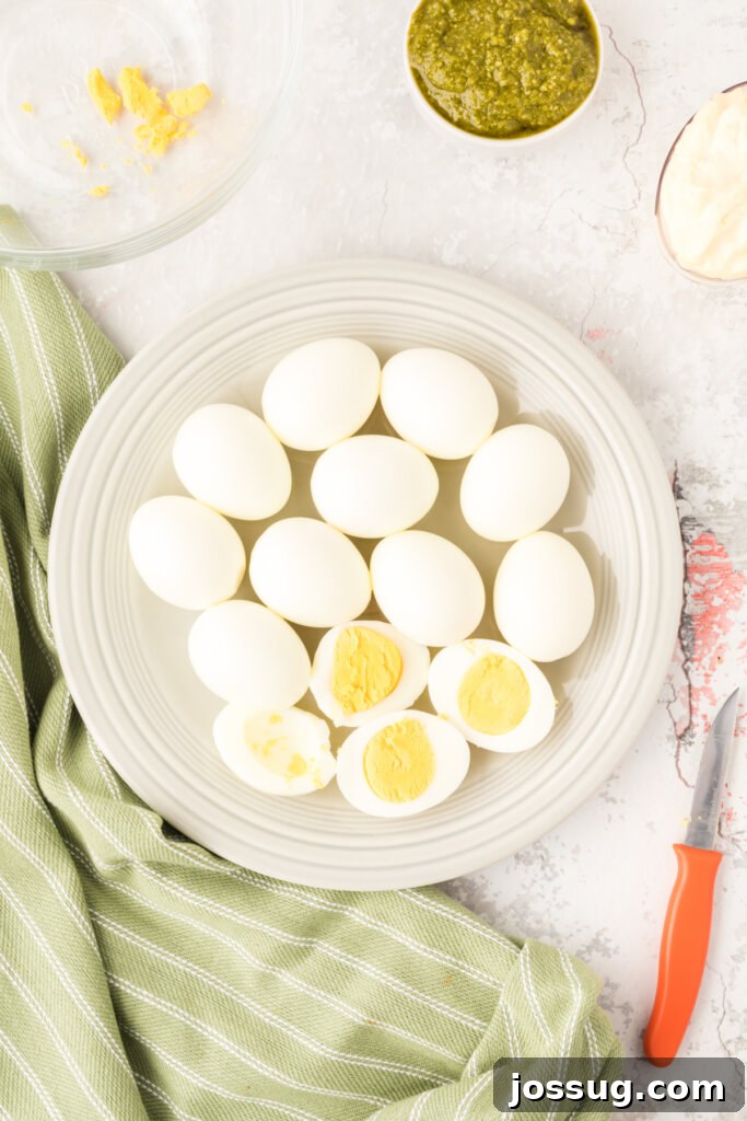 cooked eggs being cut in half