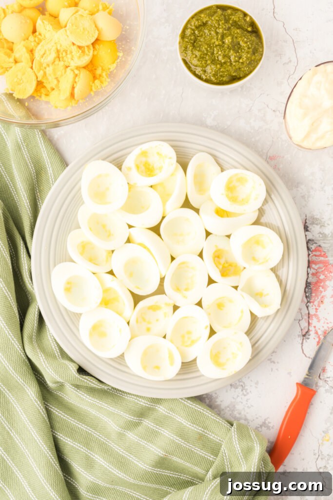 hard boiled eggs cut in half with the yolks removed