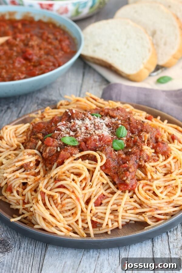 Slow Cooker Spaghetti Sauce with pasta on a plate.