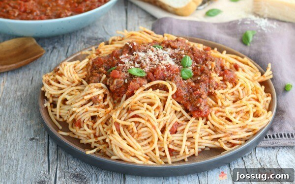 Slow Cooker Spaghetti Sauce with pasta on a plate.
