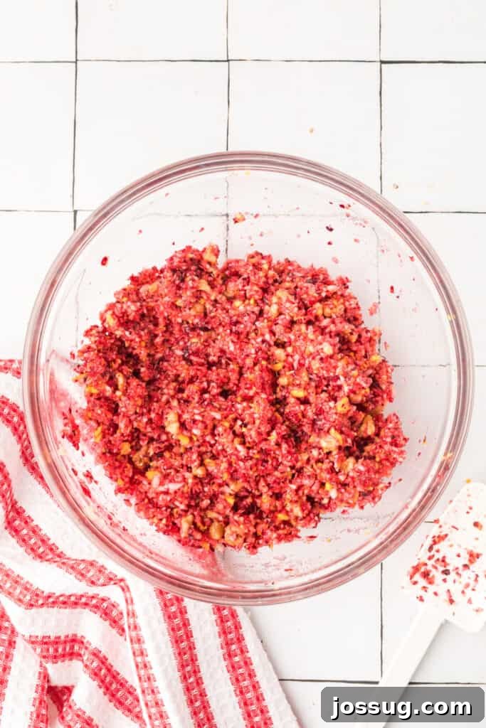 Cranberry Burst 16 Fully mixed cranberry relish showing bright red color and evenly combined texture in a glass bowl.