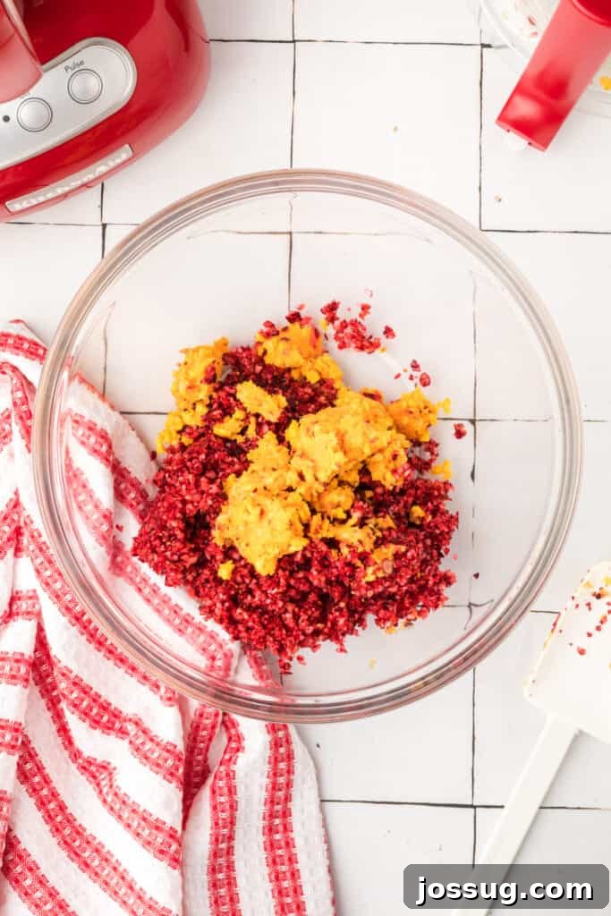 Cranberry Burst 9 Mixing bowl with chopped cranberries and oranges combined, showing red and orange colors blending together.