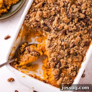 sweet potato casserole with a spoon in the dish