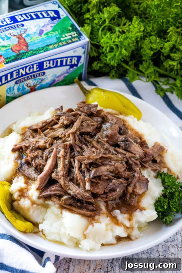 Mississippi Pot Roast with rich gravy served over creamy mashed potatoes