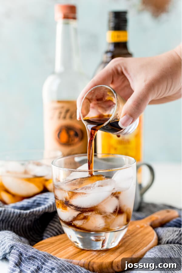 Velvet Russian 4 Coffee-flavored liqueur being poured into a cocktail glass