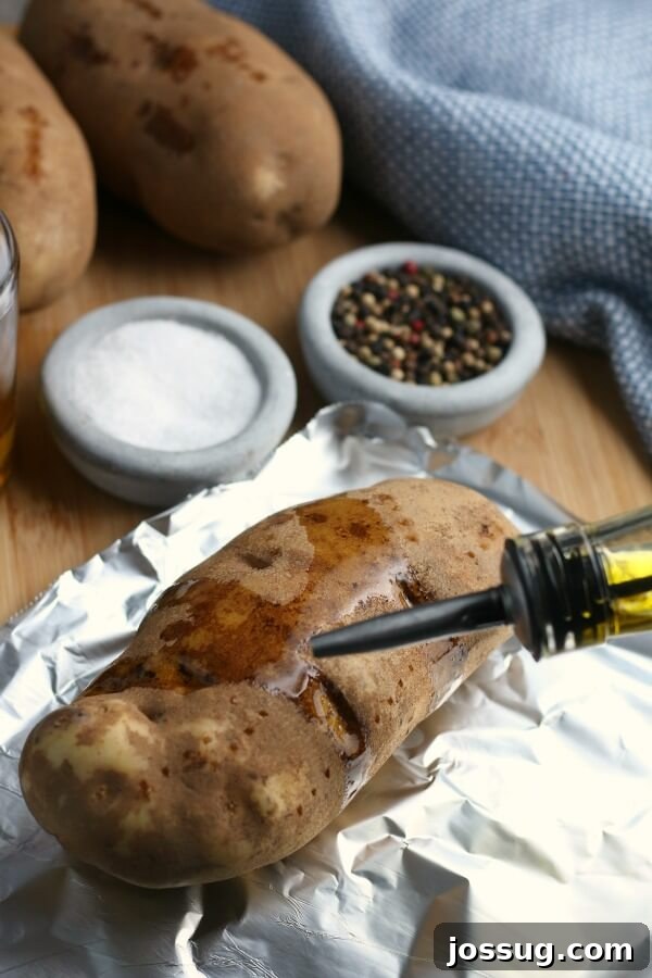 covering the potato with oil