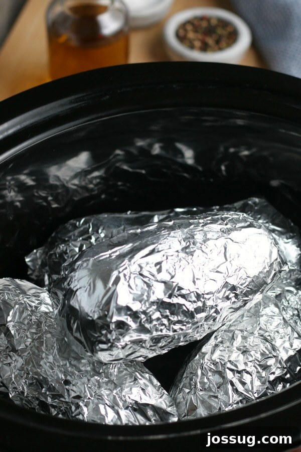 foil wrapped potatoes in slow cooker crock