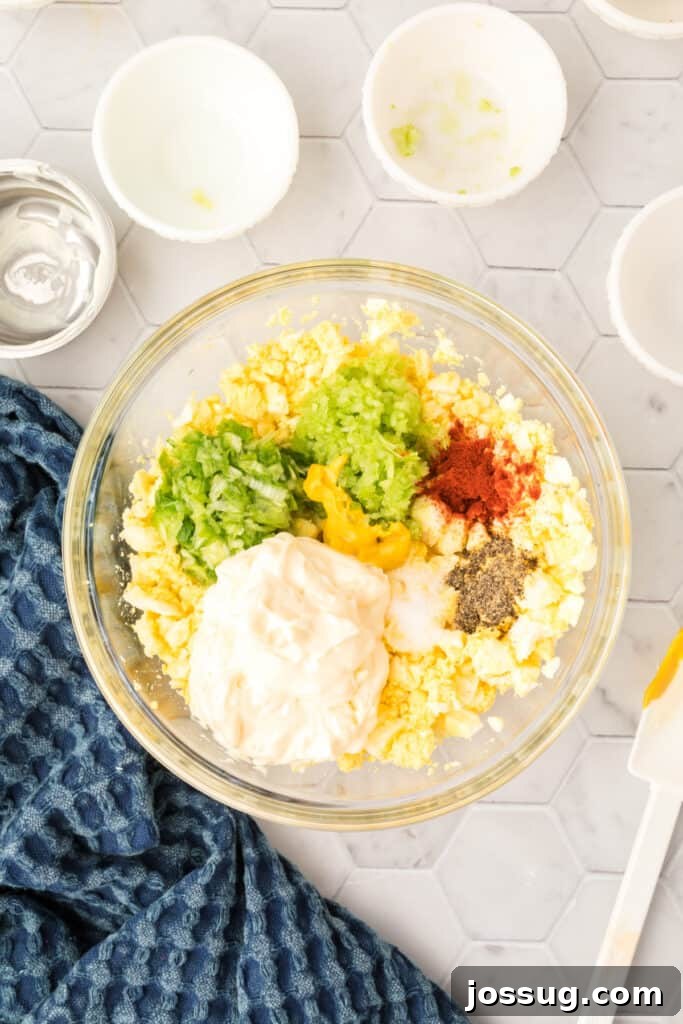 Step 5 of making egg salad: Add all remaining ingredients to the chopped eggs and mix well.