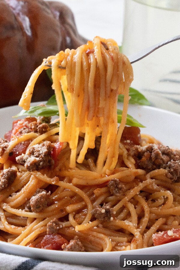 A fork twirling a bite of Instant Pot spaghetti, ready to be enjoyed.