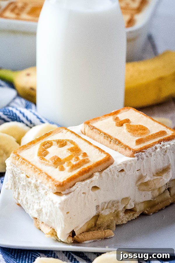 paula deen's banana pudding on plate with glass of milk in background