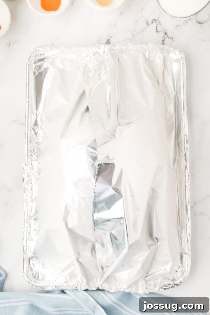 Cover the baking dish with foil and place it in the preheated oven. Bake for 2 hours or until internal temperature is 140°F.