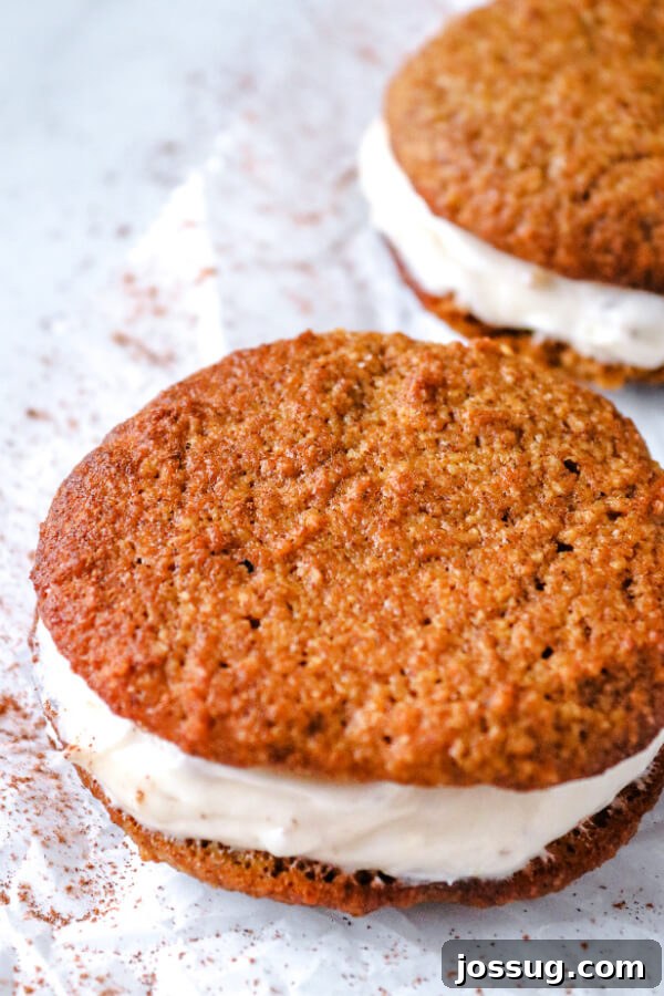 Pumpkin Spice Keto Whoopie Pies 2 Keto Pumpkin Whoopie Pies with creamy cream cheese and crunchy pecan filling, perfect for a low-carb fall treat.