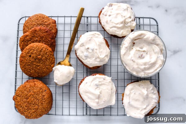 Pumpkin Spice Keto Whoopie Pies 6 Assembling Keto Pumpkin Whoopie Pies, showing the filling being spread between two cookies.