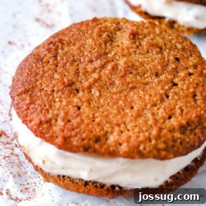 Closeup of a finished Keto Pumpkin Whoopie Pie, showing the filling.