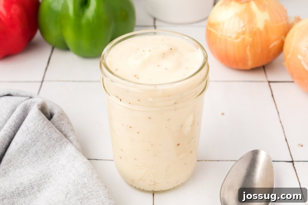 Two glass jars filled with homemade condensed cream soup substitute, ready for storage or immediate use.