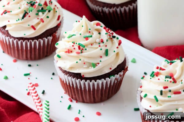 Irresistible Cream Cheese Swirl 8 cupcakes on white plate with sprinkles