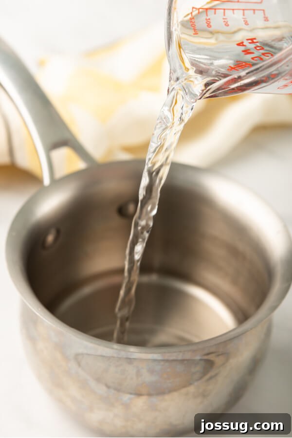 Liquid Gold Sweetener 3 adding water to pan