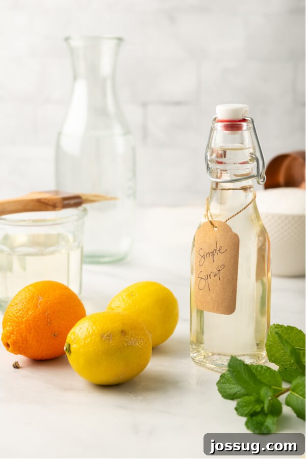 Liquid Gold Sweetener 7 citrus and mint with a bottle of simple syrup