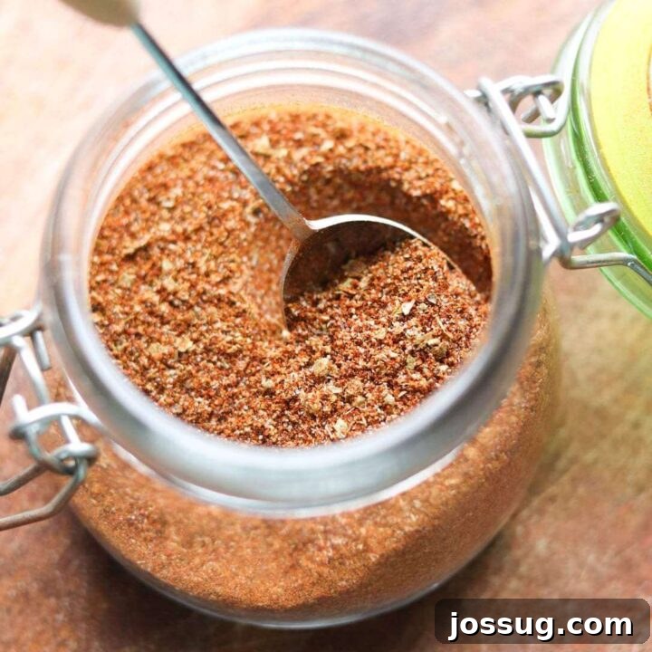 Homemade Whole30 and Keto Taco Seasoning in a clear jar, ready for use.