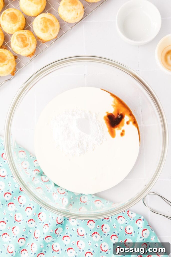 Pillowy Cream Dreams 16 In a large bowl, combine heavy cream, vanilla extract, and powdered sugar, ready for whipping into a decadent pastry cream.