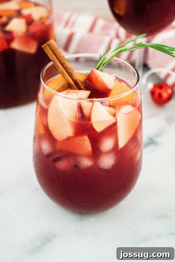 holiday sangria in a stemless wine glass