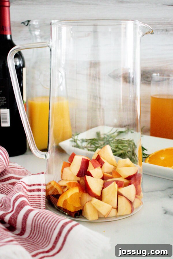 apples and oranges in pitcher