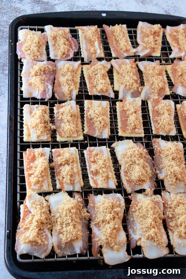 Candied Bacon Crackers 5 Generous amount of brown sugar evenly sprinkled over bacon-topped crackers, creating a beautiful contrast and promising a sweet, caramelized glaze after baking.