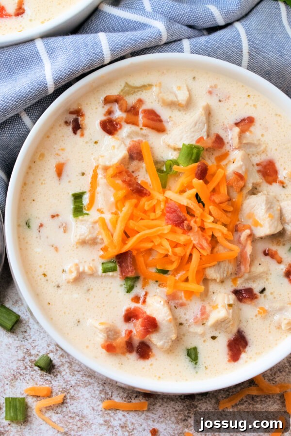 Creamy Chicken Bacon Ranch Delight 3 Overhead close-up view of a bowl of rich Chicken Bacon Ranch Soup, showcasing its creamy texture and delicious toppings.